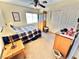 Cozy bedroom with neutral colors, a ceiling fan, and closet space at 11027 Dornoch Castle St, Las Vegas, NV 89141