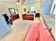 Bedroom with a ceiling fan, plantation shutters, and carpet flooring at 11027 Dornoch Castle St, Las Vegas, NV 89141