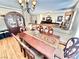 Classic dining room featuring a wooden table, decorative chairs, and elegant lighting fixtures throughout at 11027 Dornoch Castle St, Las Vegas, NV 89141