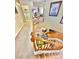 View of a second floor hallway with wooden banister overlooking the living area and a laundry area at 11027 Dornoch Castle St, Las Vegas, NV 89141