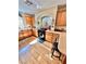 Well-lit kitchen featuring wood cabinets, a modern stove, and a breakfast bar with barstool seating at 11027 Dornoch Castle St, Las Vegas, NV 89141