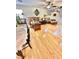 Inviting living room with a cozy sofa, wooden coffee table, and a staircase leading to the upper level at 11027 Dornoch Castle St, Las Vegas, NV 89141