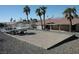 Spacious backyard with a sandbox, picnic table, and views of mature palm trees at 1108 Sidehill Way, Las Vegas, NV 89110