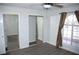 Bedroom with mirrored closet doors, window, and wood-look flooring at 1108 Sidehill Way, Las Vegas, NV 89110