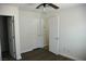 Bright bedroom with wood floors, ceiling fan, and white doors at 1108 Sidehill Way, Las Vegas, NV 89110