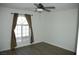 A bright bedroom with a large window and wood-look flooring at 1108 Sidehill Way, Las Vegas, NV 89110