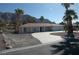 Inviting single-story home showcasing desert landscaping, a spacious driveway, and an attached three-car garage at 1108 Sidehill Way, Las Vegas, NV 89110