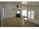 Open-concept living space featuring neutral paint, tile flooring, a fireplace, and easy access to the kitchen area at 1108 Sidehill Way, Las Vegas, NV 89110