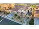 A high angle view shows a single-story home with tile roof, desert landscaping, and attached two car garage at 1223 Casa Palermo Cir, Henderson, NV 89011