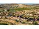 Aerial view of desert community with golf course, lush landscaping, and mountain views at 1223 Casa Palermo Cir, Henderson, NV 89011