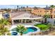 Aerial view of a home featuring a tile roof, covered patio, pool, and nearby mountains at 1223 Casa Palermo Cir, Henderson, NV 89011