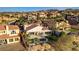 Aerial view of a home with a pool, patio, and desert landscaping, mountain backdrop in distance at 1223 Casa Palermo Cir, Henderson, NV 89011