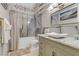 Stylish bathroom features marble-like tile, a bathtub with shower, and a vessel sink at 1223 Casa Palermo Cir, Henderson, NV 89011