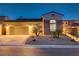 Attractive home featuring stone accents, mature landscaping, and a neutral color palette at 1223 Casa Palermo Cir, Henderson, NV 89011