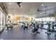 Well-equipped gym with rows of stationary bikes and floor to ceiling windows for stunning views at 1223 Casa Palermo Cir, Henderson, NV 89011