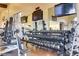 Weight room featuring dumbbells, weight machines, and mirrored walls at 1223 Casa Palermo Cir, Henderson, NV 89011