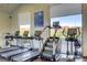 Well-equipped gym with cardio machines, weights, and stunning mountain views at 1223 Casa Palermo Cir, Henderson, NV 89011