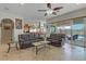 Open-concept living room showcasing the kitchen, living area, and outdoor access to the backyard pool at 1223 Casa Palermo Cir, Henderson, NV 89011