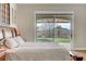 A naturally lit main bedroom features wood floors and backyard views through sliding glass door at 1223 Casa Palermo Cir, Henderson, NV 89011