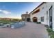 Spacious outdoor lounge area with comfortable seating and stunning views of the lush golf course at 1223 Casa Palermo Cir, Henderson, NV 89011