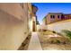 Inviting patio area with outdoor seating and illuminated landscaping at 1223 Casa Palermo Cir, Henderson, NV 89011