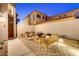 Charming outdoor patio area with seating and desert landscaping at 1223 Casa Palermo Cir, Henderson, NV 89011