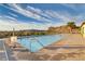 Resort-style pool with lounge chairs and stunning views of the surrounding mountains at 1223 Casa Palermo Cir, Henderson, NV 89011