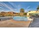 Relaxing community pool with mountain views and plenty of space for lounging at 1223 Casa Palermo Cir, Henderson, NV 89011