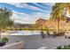 A tranquil swimming pool offers residents a place to relax and enjoy the desert landscape at 1223 Casa Palermo Cir, Henderson, NV 89011