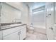 Modern bathroom featuring white cabinets, granite countertop, and a shower-tub combination at 1580 S Outlaw St, Pahrump, NV 89060