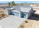 New construction home featuring an extended driveway and three car garage, all with mountain views at 1580 S Outlaw St, Pahrump, NV 89060