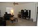 Bright living room features tile floors, ceiling fan, and neutral walls at 1580 S Outlaw St, Pahrump, NV 89060