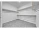 Walk-in closet featuring built-in shelving and ample storage space at 1580 S Outlaw St, Pahrump, NV 89060