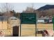 Sign for Blue Diamond Park with view of soccer field, park information, and recreation area at 18 Allegro St, Blue Diamond, NV 89004