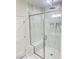 Modern glass shower featuring a rain shower head, bench seating and designer tile at 1838 Princeton St, North Las Vegas, NV 89030