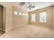 Bright bedroom featuring a ceiling fan and large windows at 1964 Oliver Springs St, Henderson, NV 89052