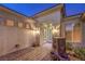 Elegant front entrance with a decorative fountain and custom double doors at 1964 Oliver Springs St, Henderson, NV 89052