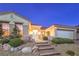 Inviting home exterior featuring a gated entryway, desert landscaping, and a two car garage at 1964 Oliver Springs St, Henderson, NV 89052