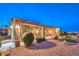 Charming single-story home featuring desert landscaping and a covered entryway with stone pillars at 1964 Oliver Springs St, Henderson, NV 89052