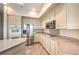 Kitchen with stainless steel appliances, granite counters, ample cabinet space, and tile flooring at 1964 Oliver Springs St, Henderson, NV 89052