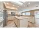 Open concept kitchen with granite counters, island and stainless appliances in a light and bright room at 1964 Oliver Springs St, Henderson, NV 89052