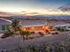 Beautiful home with desert landscaping, covered patio and city views at sunset at 1964 Oliver Springs St, Henderson, NV 89052