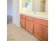 Bathroom features a light wood vanity with a white countertop and sink at 2050 N Los Feliz St # 176, Las Vegas, NV 89156