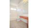 Bright bathroom with a white tub, toilet, and wood vanity, offering a clean and functional space at 2050 N Los Feliz St # 176, Las Vegas, NV 89156