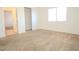 Clean bedroom featuring neutral carpet, closet and natural light at 2050 N Los Feliz St # 176, Las Vegas, NV 89156