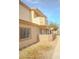 View of the home featuring a private balcony and neutral stucco at 2050 N Los Feliz St # 176, Las Vegas, NV 89156