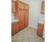 Cozy kitchen with tile flooring and wood cabinets at 2050 N Los Feliz St # 176, Las Vegas, NV 89156