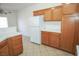 Kitchen showcasing wood cabinetry and tile countertops at 2050 N Los Feliz St # 176, Las Vegas, NV 89156