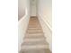 Carpeted stairs leading to the upper level with a white railing at 2050 N Los Feliz St # 176, Las Vegas, NV 89156