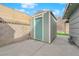 Backyard with a storage shed and a concrete patio with clear blue skies at 2058 Citroen St, Las Vegas, NV 89142